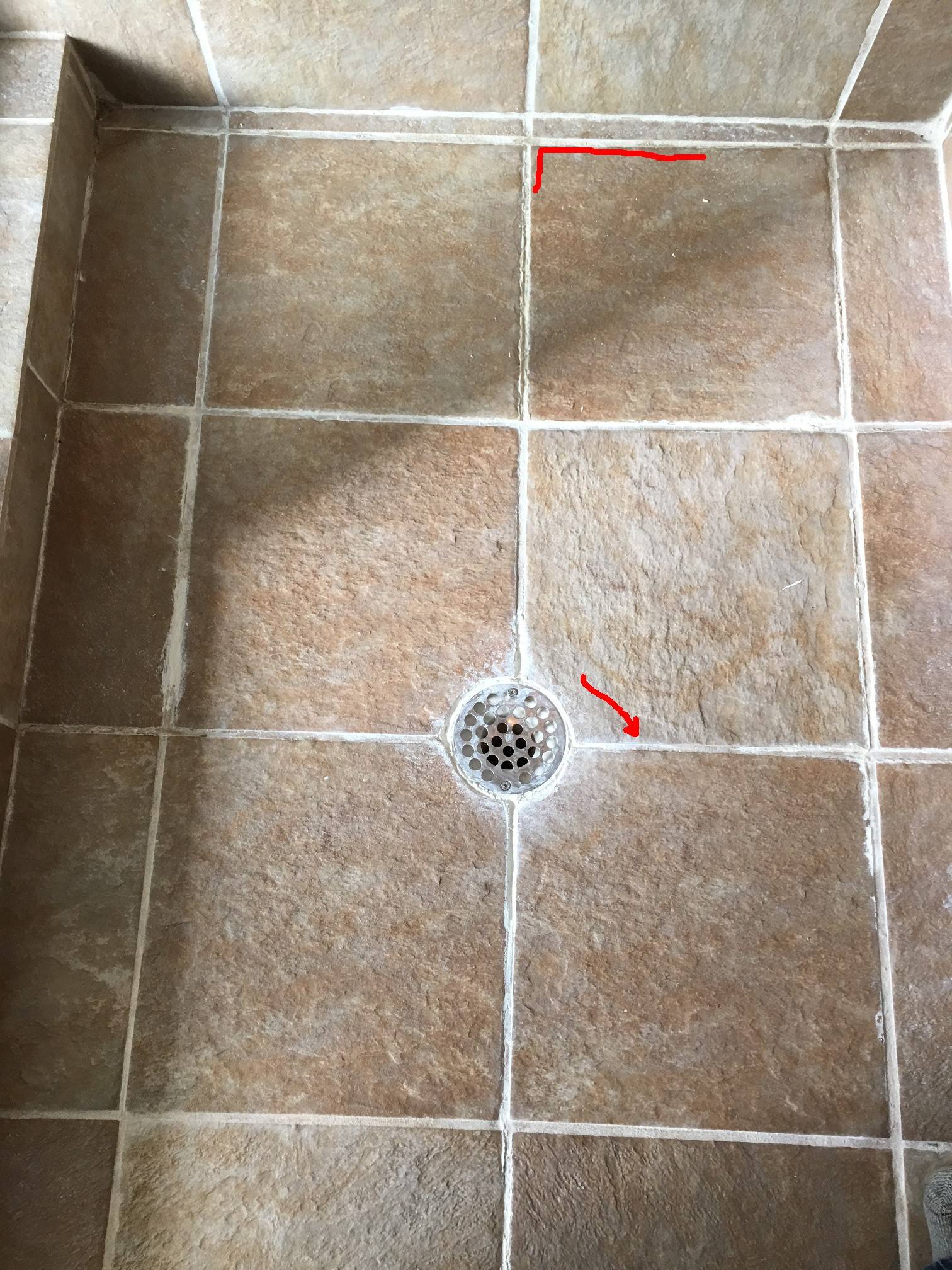 how to dry out water under tiles